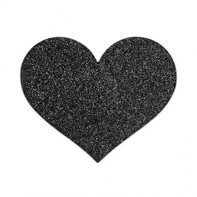 A glittery black coloured heart nipple pastie on a white background by Bijoux Indiscrets. Lingerie