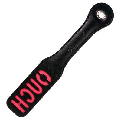 Sportsheets leather BDSM Ouch paddle in black with red writing. Paddle on a white background