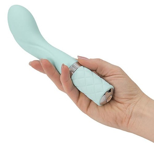 A handheld view of the Pillow Talk rechargeable g-spot vibrator in teal, on a white background - Sex Siopa, Ireland's best sex toys.