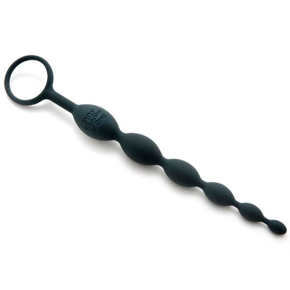 Diagonal view of the 50 Shades of Grey silicone anal beads featuring 6 graduating beads and wide ring base.